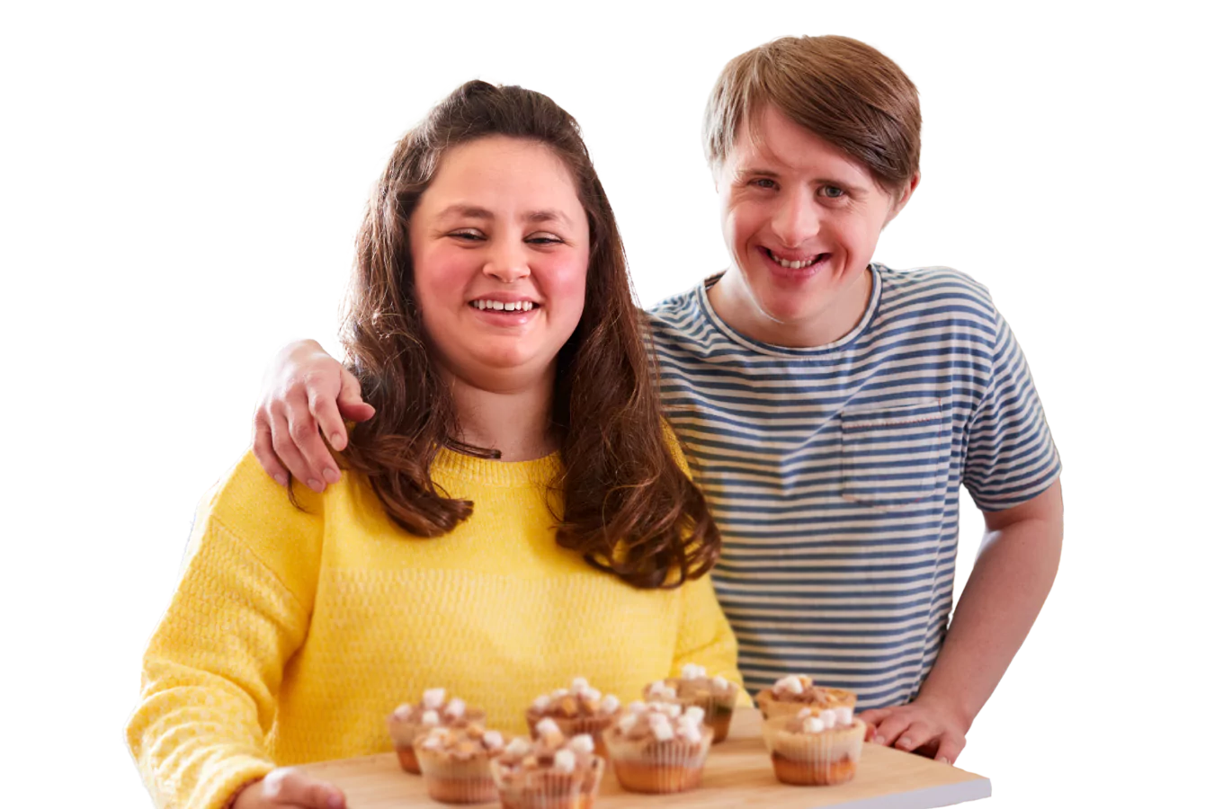Two disabled friends are smiling together after baking cupcakes