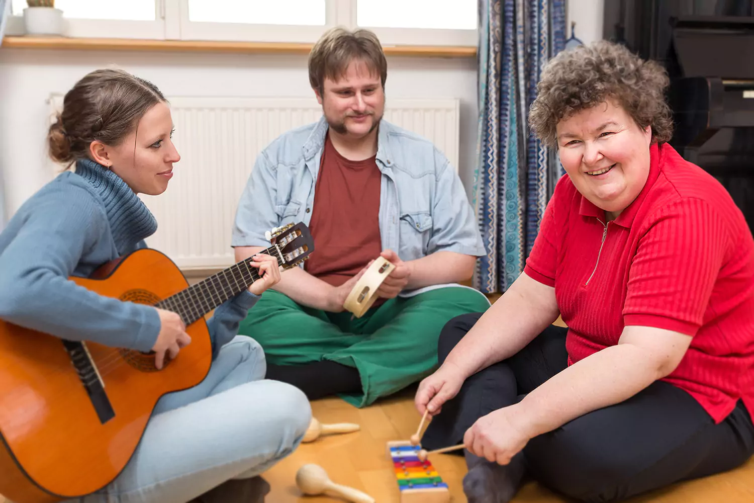 A group of disabled friends are playing musical instruments together